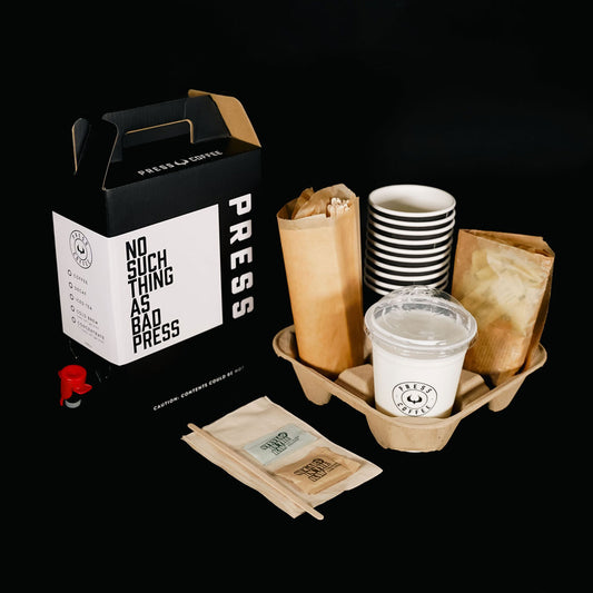 Coffee packaging set with 'PRESS' branding on a black background