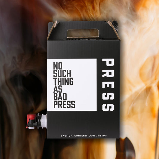 Black box with 'PRESS' and 'No such thing as bad press' text on a background of cold brew coffee with cream.